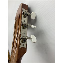 Spanish BM acoustic guitar with mahogany back and sides and spruce top L101cm; in cello carrying case; Roland foot pedal and two Yamaha foot pedals; tin D# organ pipe; folding music stand etc