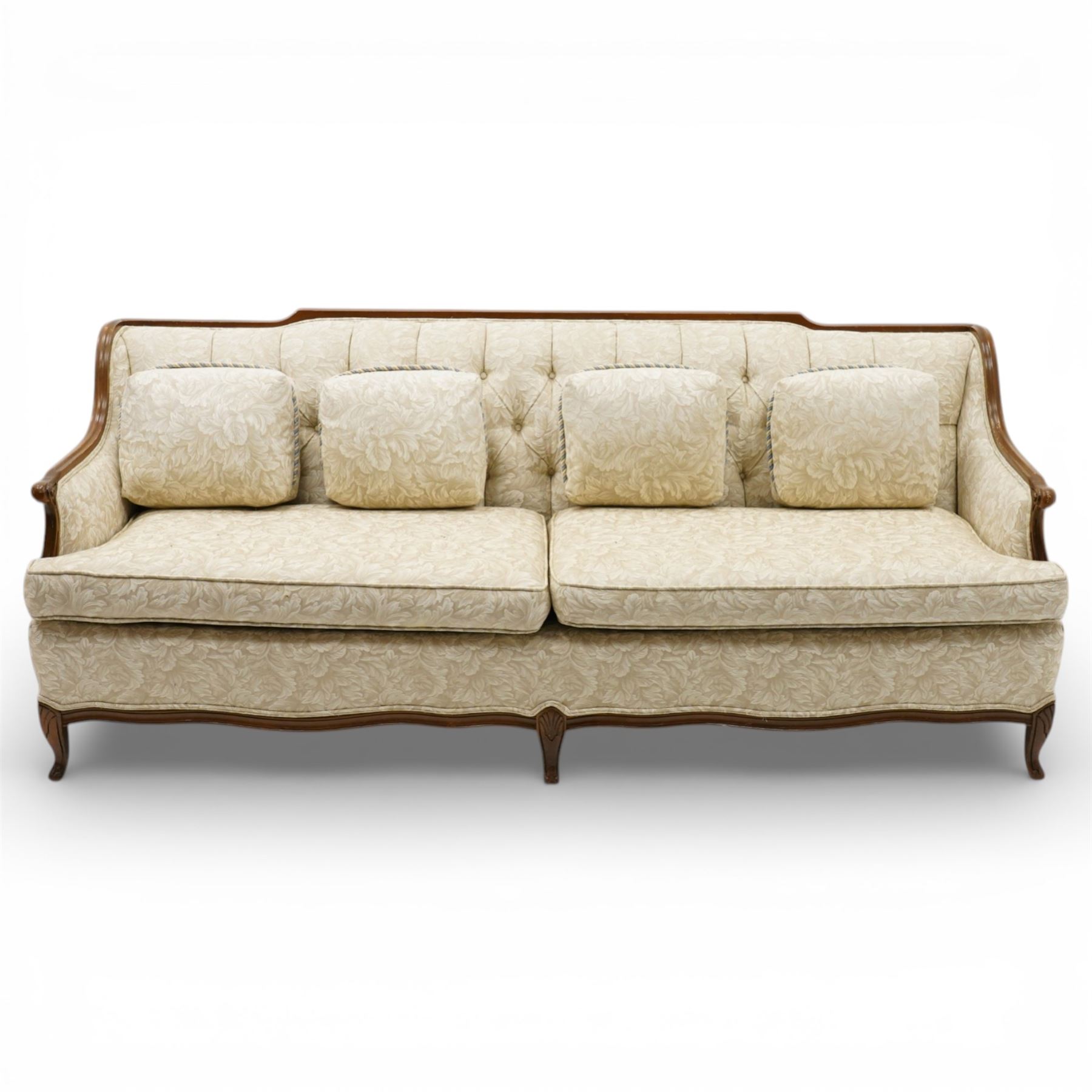 Mahogany framed three seat sofa in the Louis XV style, the shaped buttoned back above loose seat cushions and scrolling arms, raised on cabriole legs with shaped apron