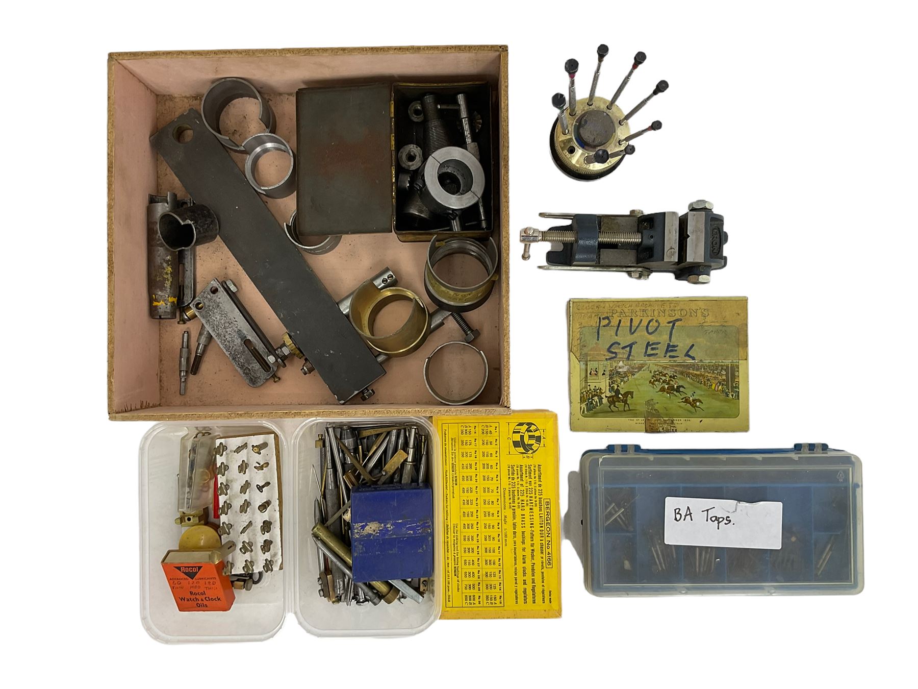 Clock mainspring winder, bench vice, assortment of clock pivot steel