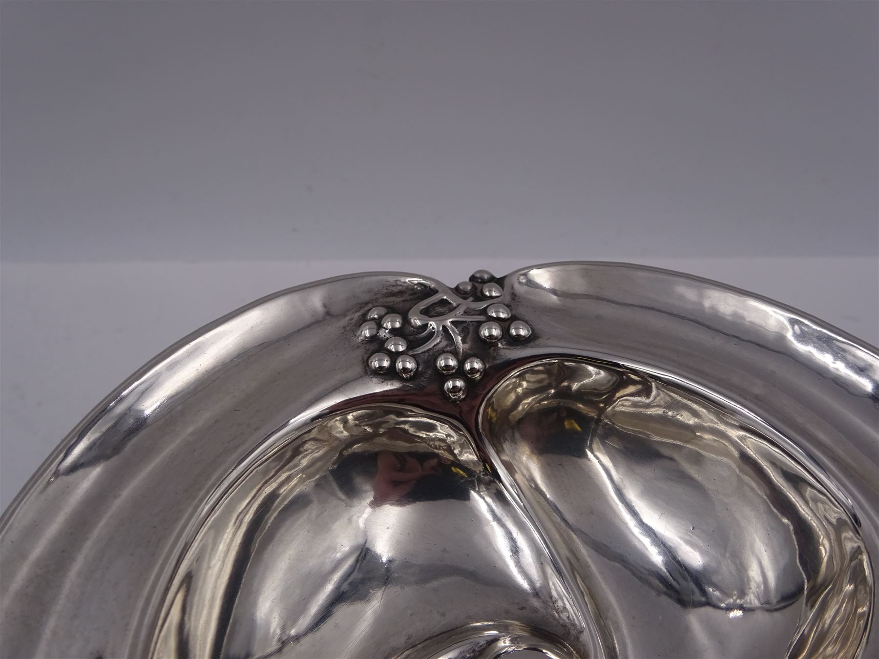 Art Nouveau silver bon bon dish, the bowl of trefoil form embossed with fruiting vines to the rim, upon a knopped pedestal and domed circular foot, hallmarked Levesley Brothers, Sheffield 1905, H8.8cm