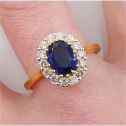 18ct gold oval kyanite and round brilliant cut diamond cluster ring, stamped 18K, kyanite 1.68 carat, with World Gemological Institute report 