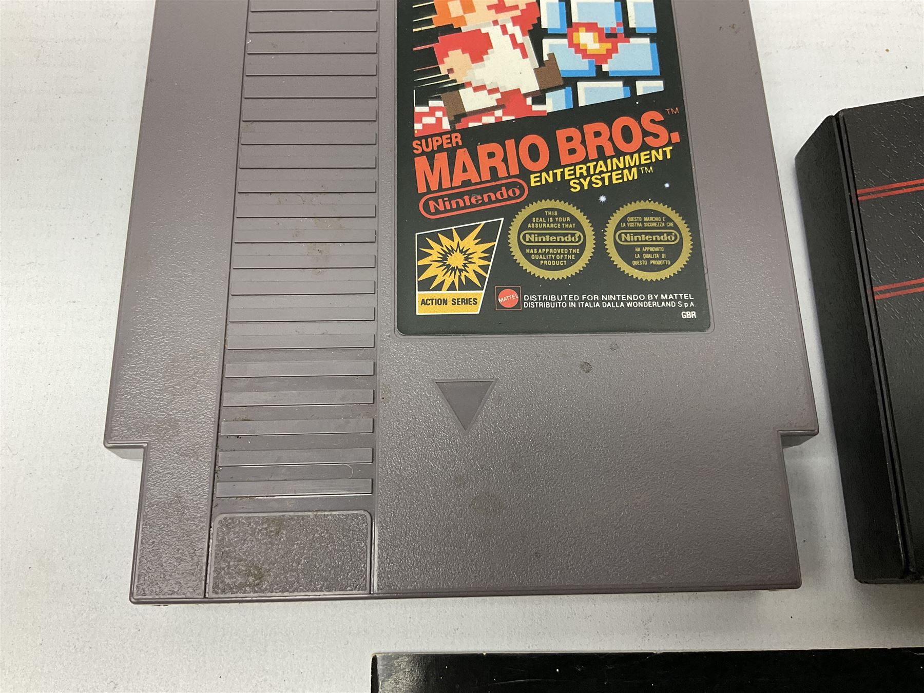 Nintendo Entertainment System (1985) console with two controllers, accessories and instruction booklet. NES Games ‘Duck Hunt’ with Nintendo Zapper gun, ‘Pinball’ and ‘Super Mario Bros.’, all with original sleeves and instruction booklets. NES game ‘Super Mario Bros. 2’ cartridge only