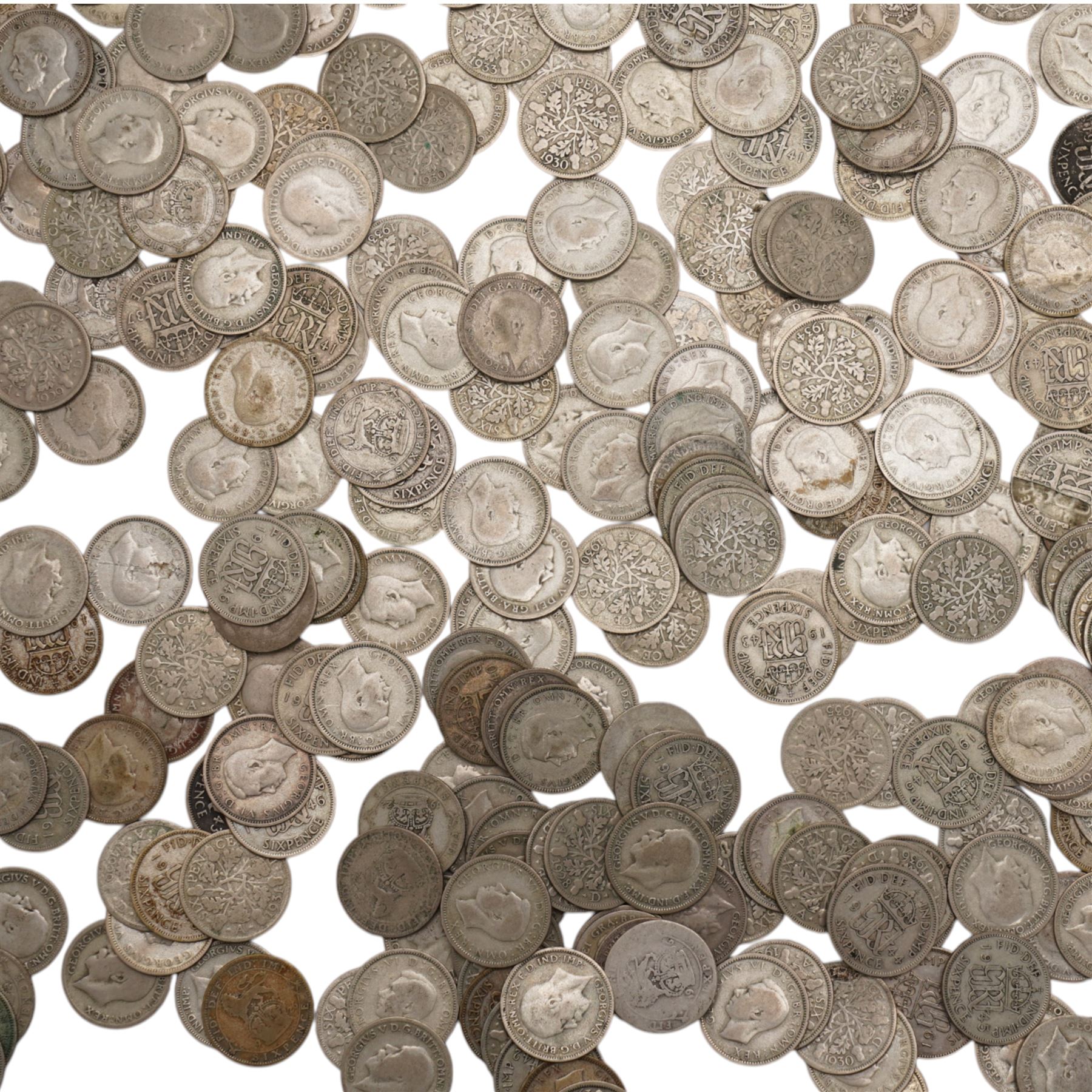 Approximately 1050 grams of Great British pre-1947 silver sixpence coins, and approximately 26 grams of Great British pre-1947 silver threepence coins