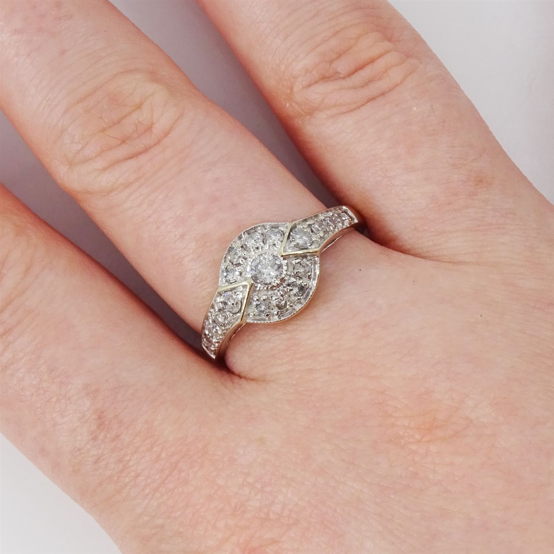 18ct gold diamond cluster ring, milgrain set with round brilliant cut diamonds and diamond set shoulders, Sheffield 2004, total diamond weight 0.50 carat