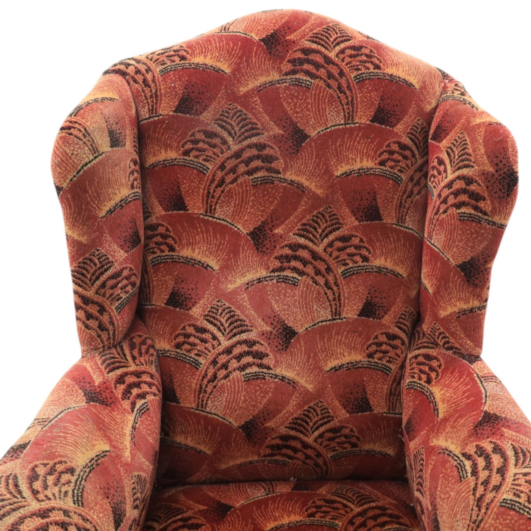 Large upholstered wingback chair, crimson geometric upholstery, carved front apron raised on cabriole supports 