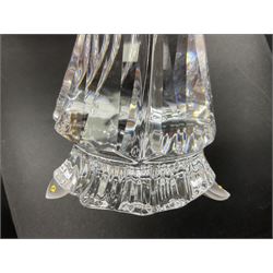 Swarovski Crystal Masquerade trilogy; 1999 Masquerade Pierrot, 2000 Columbine, 2001 Harlequin all with accompanying plaque, stand and original box, together with a glass display case with mirrored back and sides 