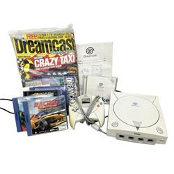 Dreamcast console, one controller, original instruction booklet with magazine and four games, ‘Aerowings’, ‘Buggy Heat’, ‘ Racing Simulation Monaco Grand Prix’ and ‘Who Wants to be a Millionaire’, all in original cases with instruction booklets 