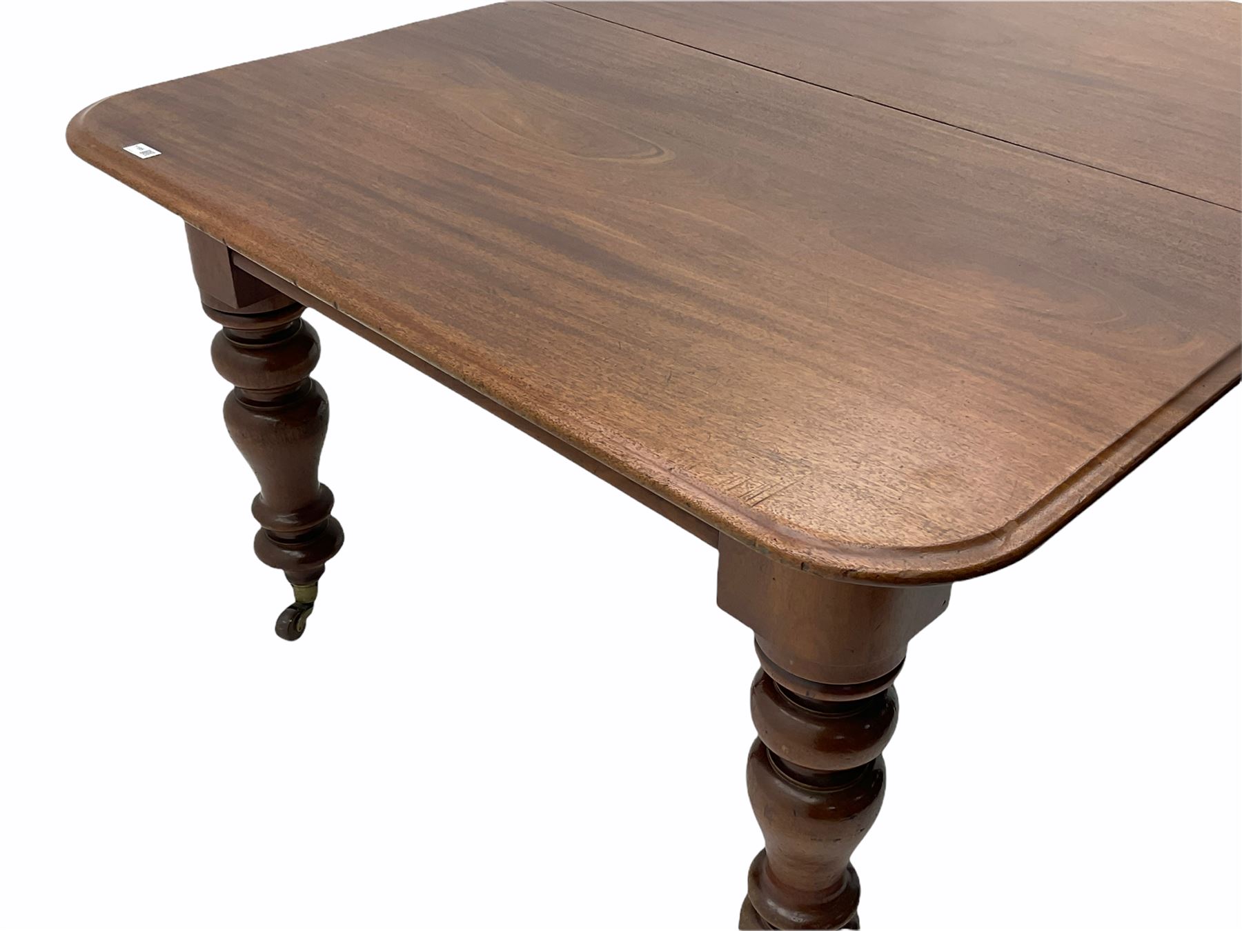 Victorian mahogany extending dining table, with leaf