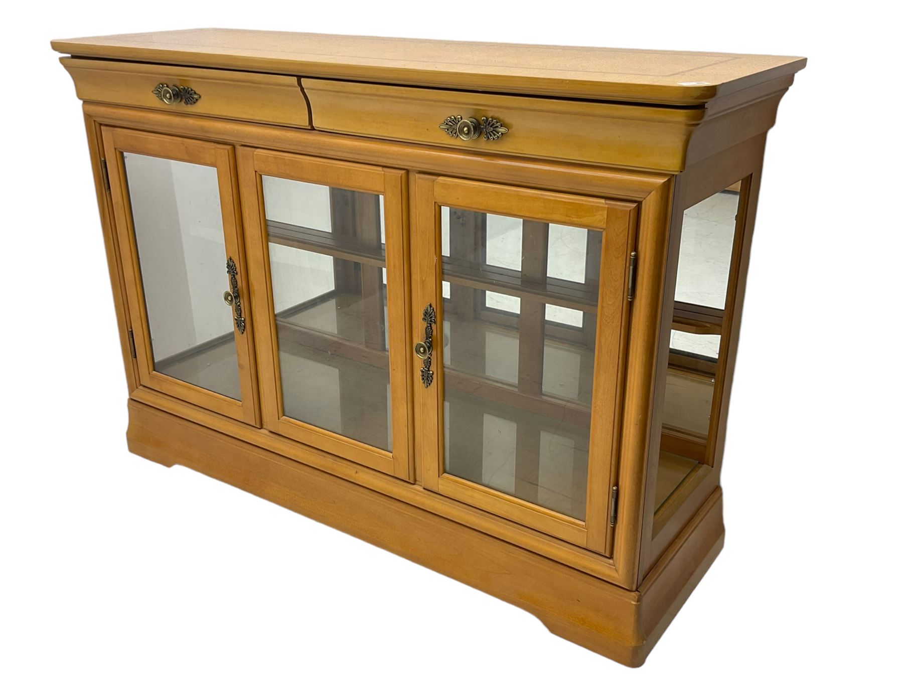 Yew wood sideboard, rectangular top with mahogany and ebony stringing, fitted with two drawers over three glazed cupboard doors enclosing glass shelves