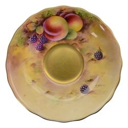 Royal Worcester fruit painted cabinet teacup and saucer, interior hand painted with apples, blackberry and cherries upon a mossy ground, the cup exterior and centre of saucer gilded, cup and saucer signed Rickells, each with puce coloured printed marks beneath, H7cm