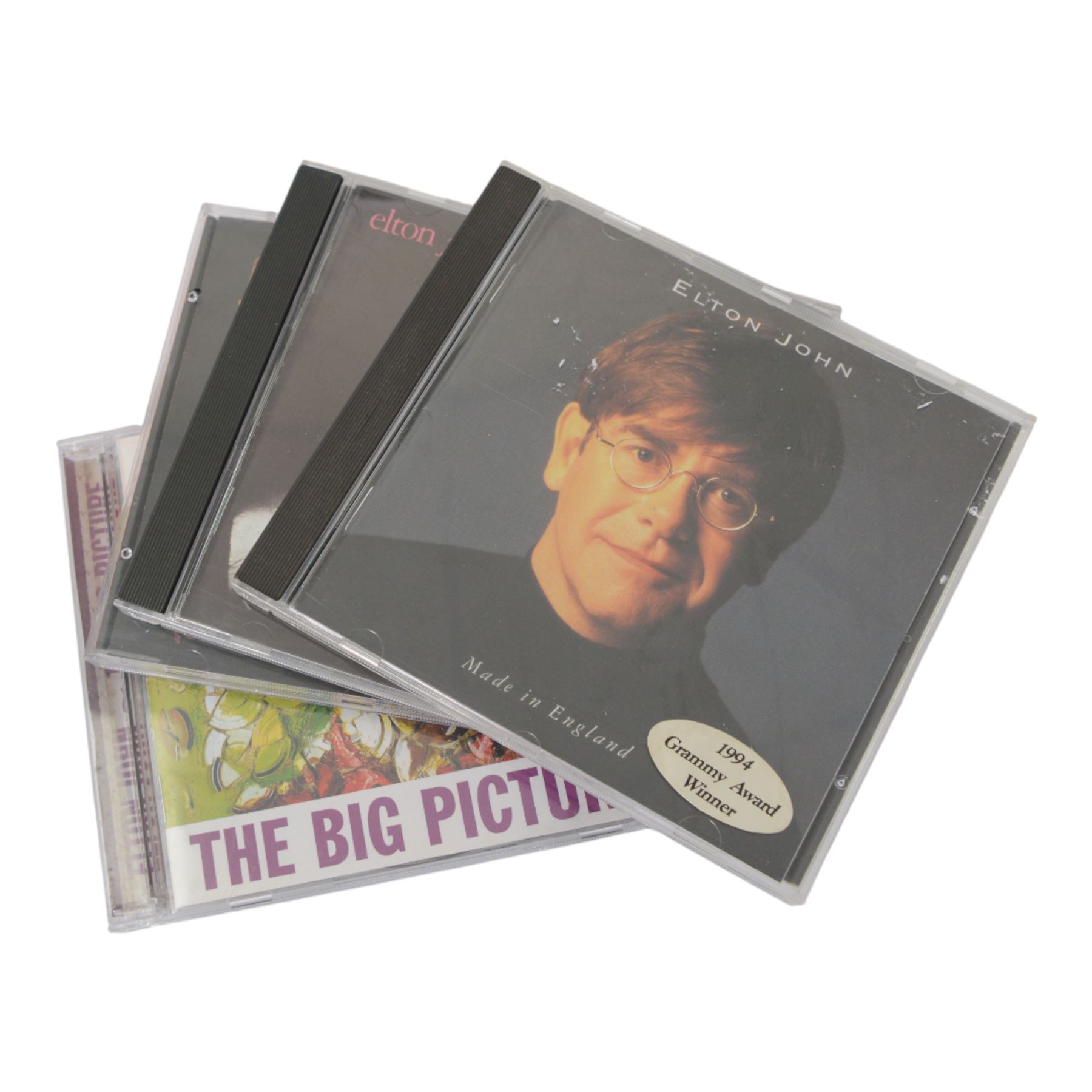 Elton John books and CDs, including first edition 'Rocket Man' book by Chris Roberts, Scattershot by Bernie Taupin signed by the author, thirteen CDs including double and triple examples and a Elton John Live at madison Square Garden DVD