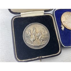 Commemorative coins and medallions, including hallmarked silver poultry medal, Royal Mint 'College of Arms Quincentenary Commemorative Medal', Selby Abbey '1069 1969' medallion, two medallions commemorating the Investiture of H.R.H. Prince Charles 1st July 1969 and a set of four coins commemorating the Investiture of Prince Charles, all cased 