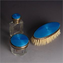 1920s silver mounted blue guilloche enamel travelling dressing table set, comprising hairbrush, comb, bottle and jar, hallmarked RWF Ltd, Birmingham 1927, contained withing tooled leather fitted case with bevelled mirror to interior