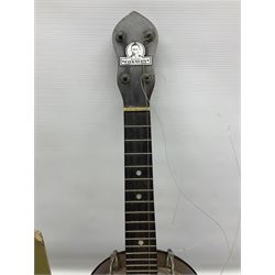 George Formby banjolele with metal plaque to headstock L55cm; in carrying case with instruction booklet.