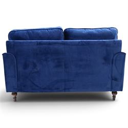 Howard design - two-seat sofa upholstered in blue fabric, traditional shape with rolled arms, on walnut finish turned feet with brushed metal cups and castors
