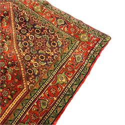Persian Hamadan red ground rug, the field decorated with Herati motifs, multiple band border with repeating floral design