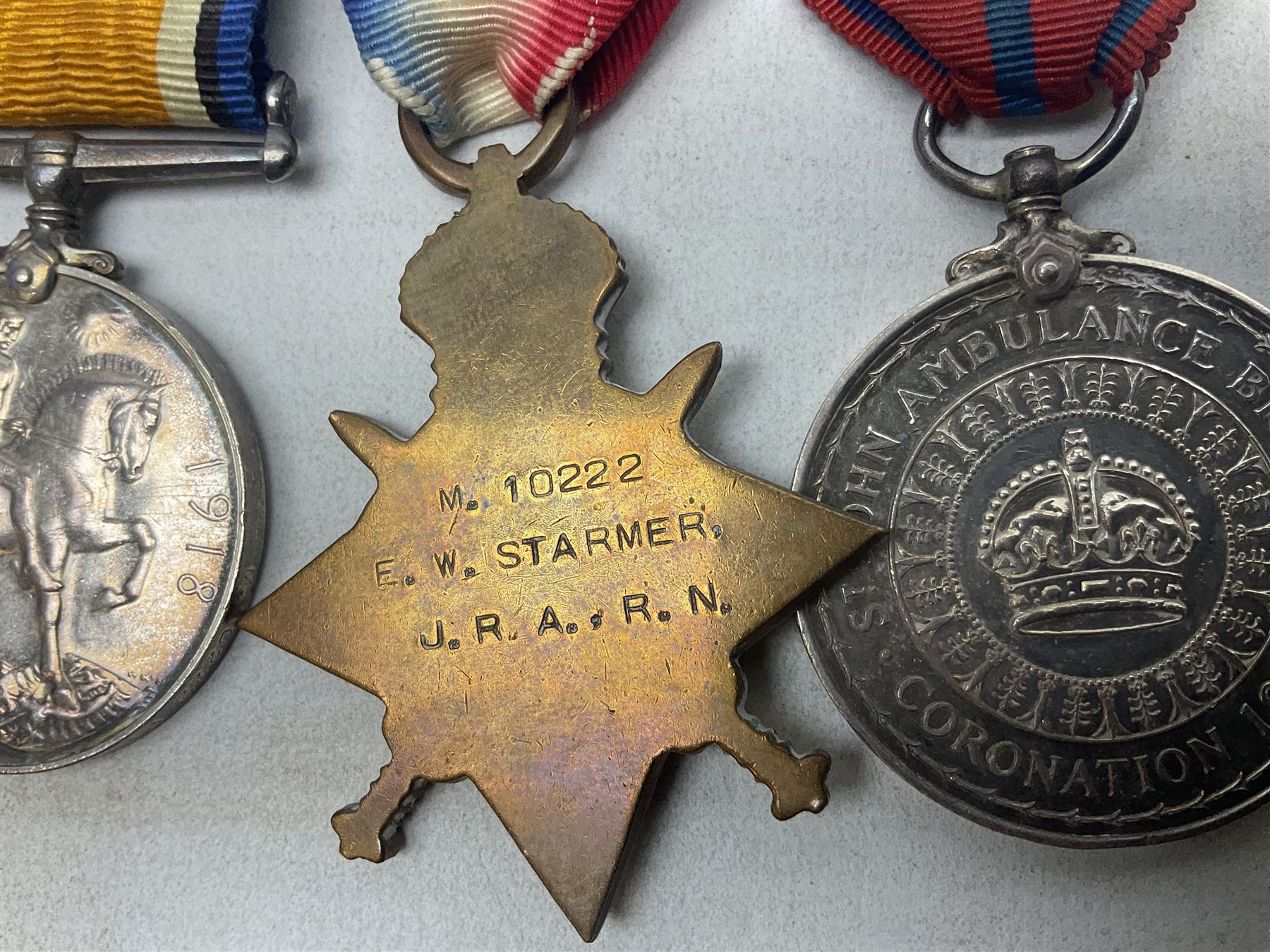 WW1 Naval group of four medals comprising British War Medal, 1914-15 Star and Victory Medal awarded to M.10222 E.W. Starmer J.R.A. (later S.R.A.) R.N.; and St. John Ambulance Brigade Coronation 1911 Medal to Pte. E.W. Starmer; all with ribbons