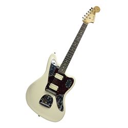 Mexican Fender Jaguar electric guitar with Humbucker pick-ups and tremolo arm, serial no.MX16741977, L101cm; in soft carrying case