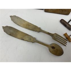 Two wooden biscuit moulds, carved loving spoon and fork, and two bradawls 