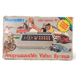 Vintage game consoles, comprising Sinclair ZX Spectrum, Zeon T-800 TV Game and Radofin Programmable Tele-Sports IV, all boxed, with six Spectrum games comprising Road Runner, Jack The Nipper, Batman, The Great Escape, Movie and Masters of the Universe
