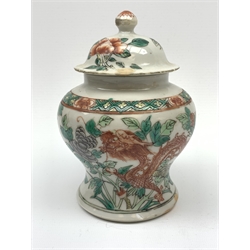 Chinese Qing Dynasty Famille Verte  jar and cover decorated with Dragons and butterflies amongst foliage H15cm