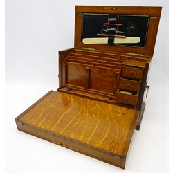  Edwardian oak correspondence box, hinged lids enclosing an fitted interior, with fold down leather writing surface, with two Gothic style brass handles, L43cm x H28cm   