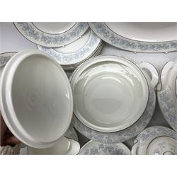 Royal Doulton tea and dinner wares in the Meadow Mist pattern, no H5007, comprising seven dinner plates, eight side plates, two lidded tureens, two jugs, lidded sucrier, oval serving dish, six teacups, seven saucers, seven tea plates and large saucer