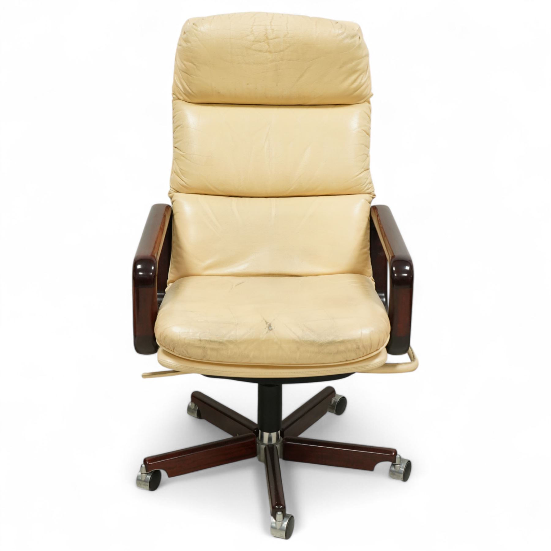 Dyrlund - contemporary pair of armchairs with solid Santos rosewood frame, rounded edges and broad armrests, seat and backrest with a removable cream leather over-stuffed cushions, together with a classic Dyrlund office chair with teak swivel base and cream leather upholstery, 62x44x109cm, (3)


Note: Dyrlund is a Danish furniture manufacturer known for its high-quality, handcrafted pieces, particularly in the mid-century modern style. Founded in 1960 by Frits Hjerte Dyrlund in Rude, Denmark, the company has remained a family business, now run by the second and third generations. Dyrlund specializes in both home and executive office furniture, focusing on practicality, solid construction, and classic design. 
