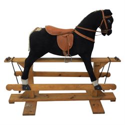 Vintage rocking horse on pine trestle base, early to mid 20th century