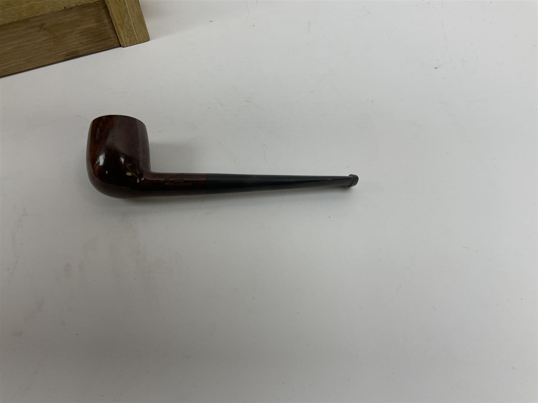 Pipes and two tiered wooden rack together with eleven pipers, including briar pipe carved as a wolf, Sea Dog straight pipe, John Brumfit pipe, meerschaum pipe ect, pipe rack H29.5cm