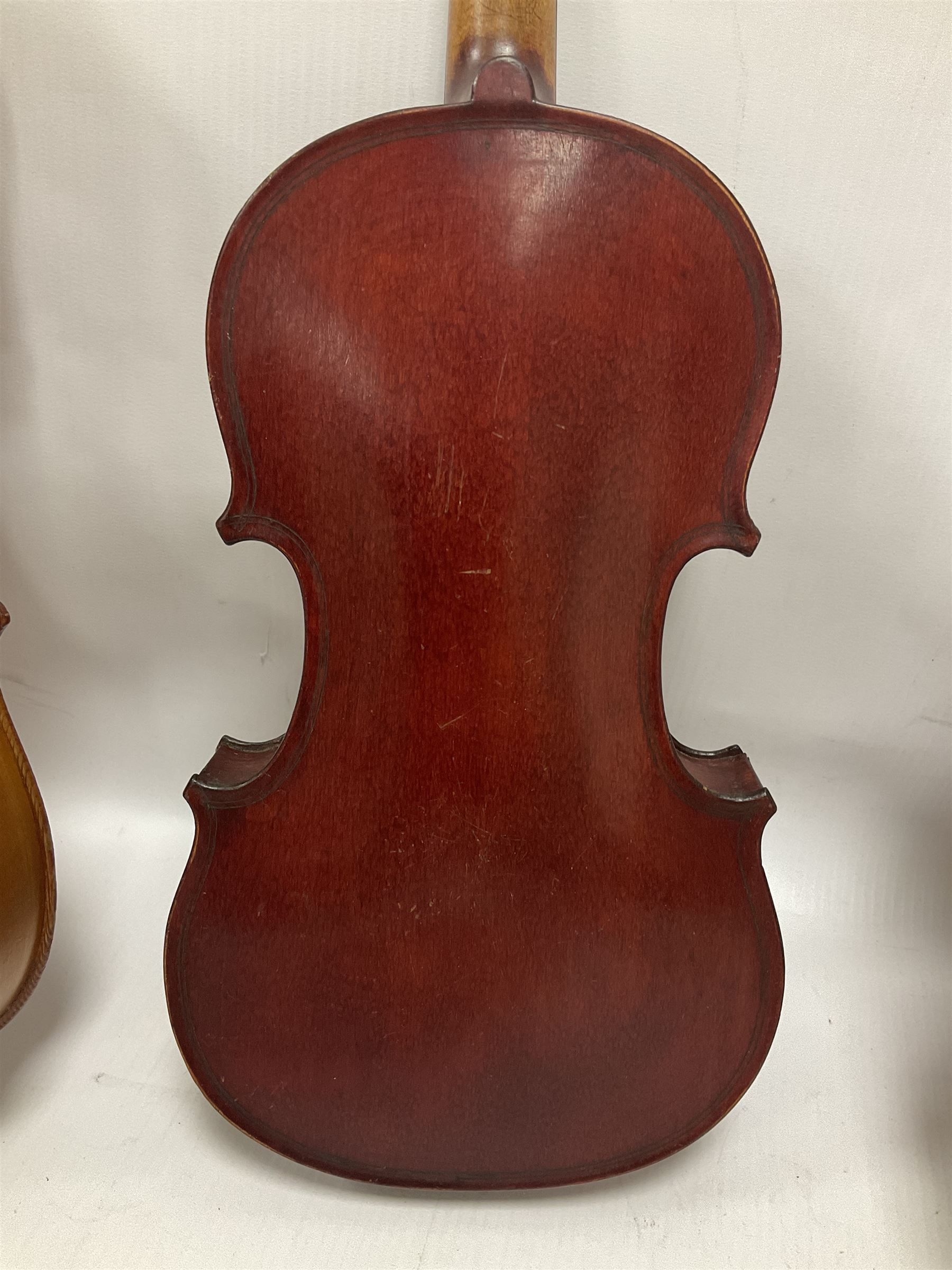 Four violins 1/8th size; half size with Nicolas Bertholini label; three-quarter size with Stradivarius copy label; and full size with Marquis De L'Air label (4)