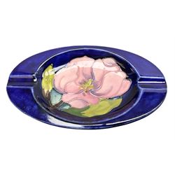 Moorcroft ashtray of oval form decorated in the Magnolia pattern, With impressed marks beneath, L16cm