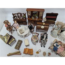 Dolls house drawing room furniture, including dressers, pink and green checked sofa and armchairs, bureau, chairs, piano, eight figures and a collection of afternoon tea miniatures