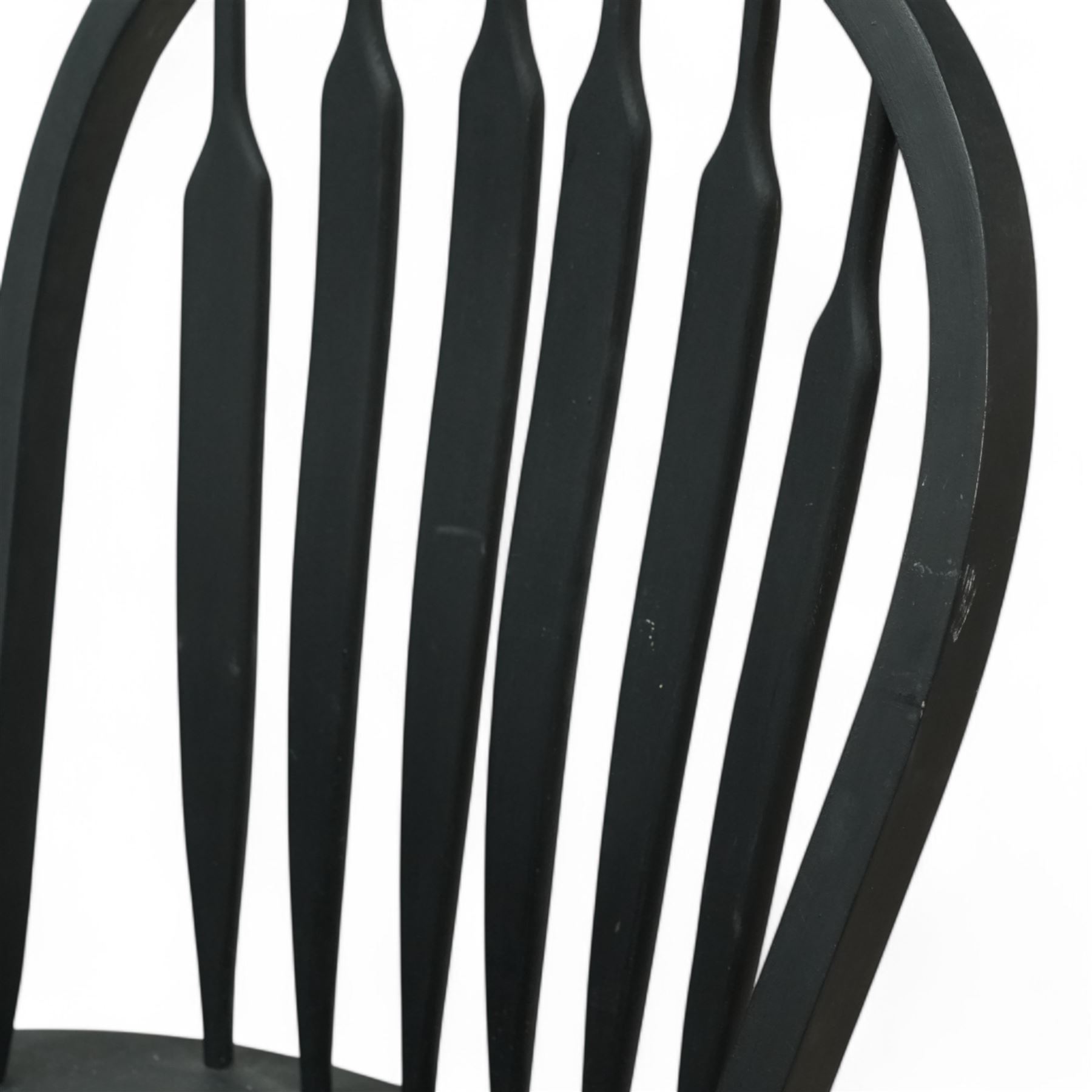 Contemporary country style pine and painted dining table and four chairs, the rectangular plank top with exposed knots and pegged detailing over black painted turned legs, the four Windsor style chairs with shaped seats, spindle splats and turned stretchers, also painted black