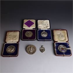 Collection of silver medals, mainly with an agricultural theme, including Poultry Club, Heywood Bicycle Club, heart shaped fob, four within leather cases 