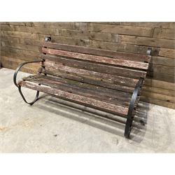 Early 20th century black painted wrought iron and wood slatted garden bench