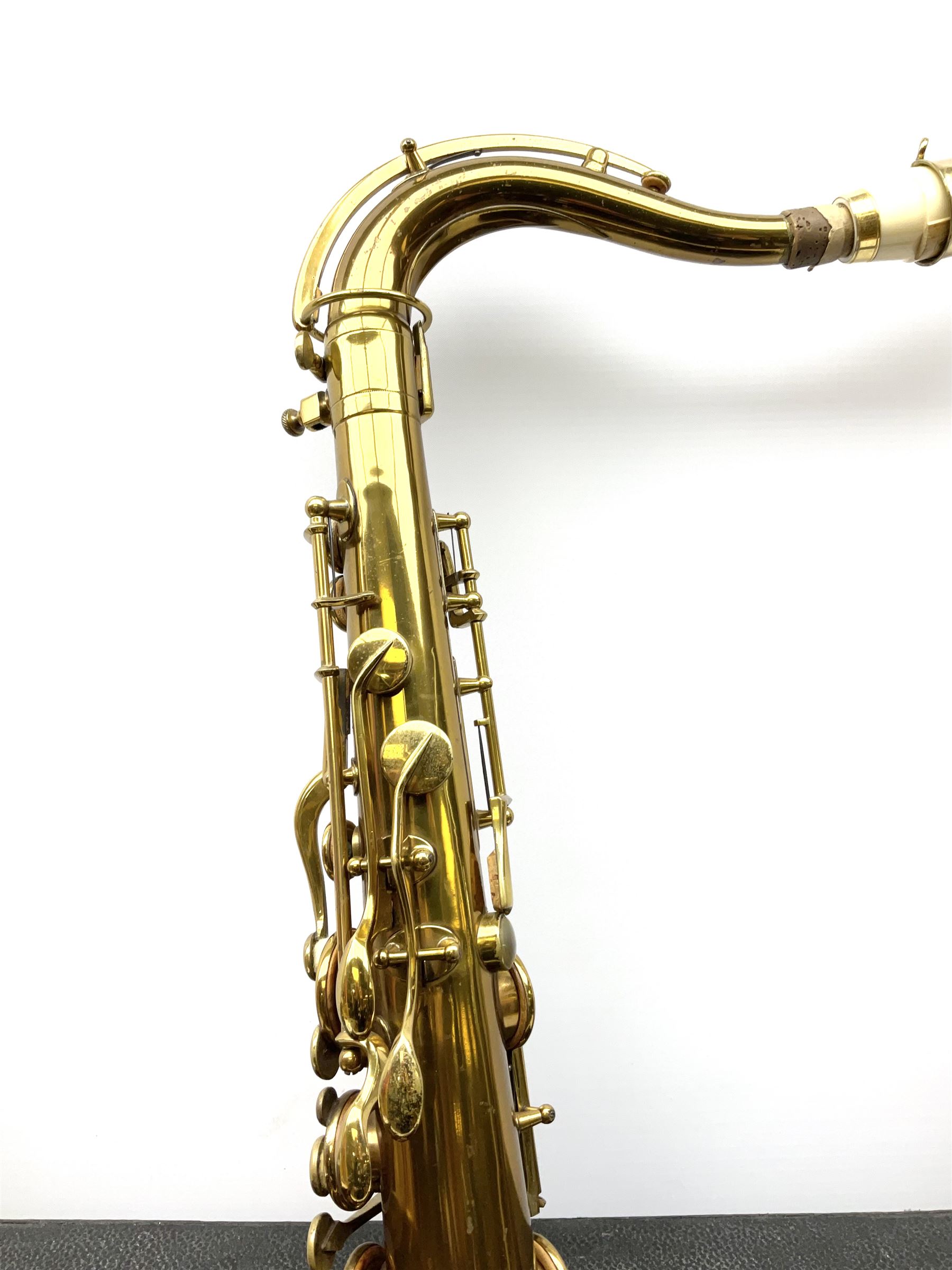 Brass tenor saxophone by Adolphe SAX, 84 Rue Myrha, Paris,  No.938 serial number 12097, H75cm excluding crook; in hard carrying case bearing plaque for Henri Selmer