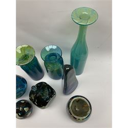 Quantity of M’dina art glass to include a streaked blue and green bottle form vase with captured bubble design and slender neck, H35cm, along with a paperweight, ovoid form vase and another vase all decorated in a blue, brown and white colour way, other contemporary glass examples etc with etched marks beneath