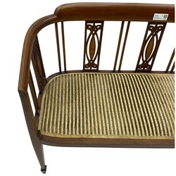 Edwardian inlaid mahogany two-seat salon sofa, curved back and arms inlaid with boxwood stringing, vertical slat back with pierced splats inlaid with satinwood, upholstered seat, on square tapering front supports with spade feet 