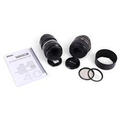 Two Micro-Nikkor camera lenses, comprising AF-S DX 40mm 1:2.8G with user manual, serial no...