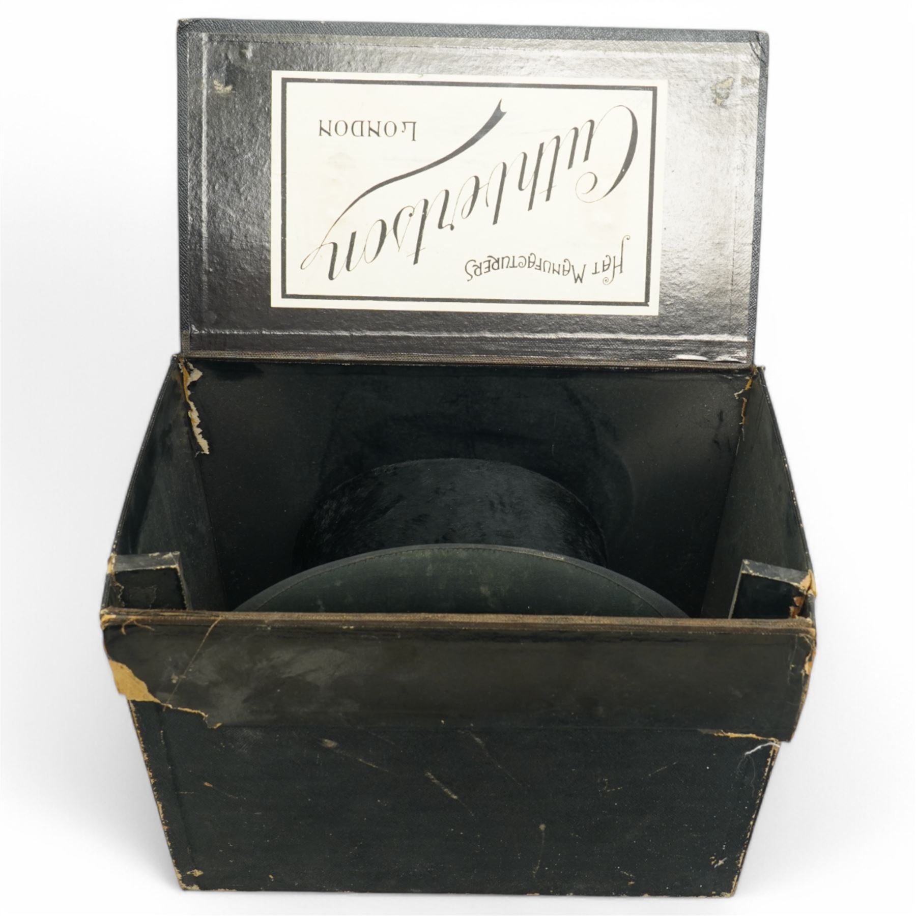 Black top hat by Lincoln Bennett & Co, retailed by Hart & Hobbs, in a Cuthbertson hat box, internal circumference approx. 54cm, and one other black top hat, internal circumference approx. 57cm (2)