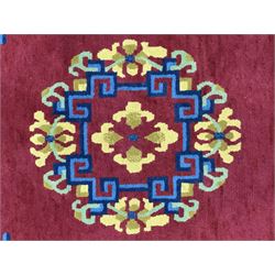 Tibetan-design handwoven rug, deep red field with three central medallions in yellow and blue, traditional yellow key border, white fringes on both ends
