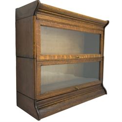 Globe Wernicke design - early 20th century oak two sectional library bookcase, enclosed by hinged and sliding glazed doors