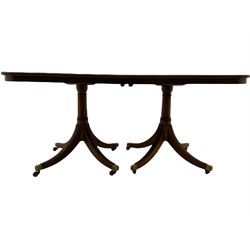 Quality Georgian design mahogany twin pedestal dining table, inlaid and crossbanded top, with two leaves