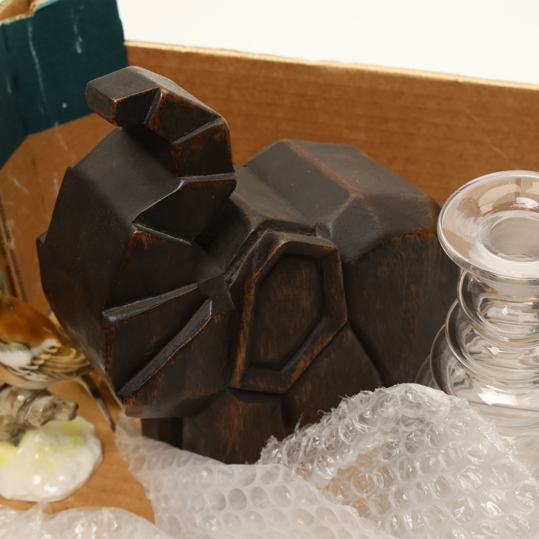 Box of miscellaneous items including coloured glass liqueur decanter and tots, two paperweights, glass carafe etc