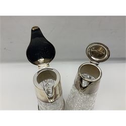 Pair of Mappin and Webb silver plate pierced pedestal bon bon dishes, together with other silver plate comprising teapot stand engraved with lion's head to centre, two cut glass claret jugs, two bottle coasters with acorn decoration, two open salts upon dolphin mounts, tea caddy, three piece cruet set and a large oval tray with pierced sides and upon four ball feet