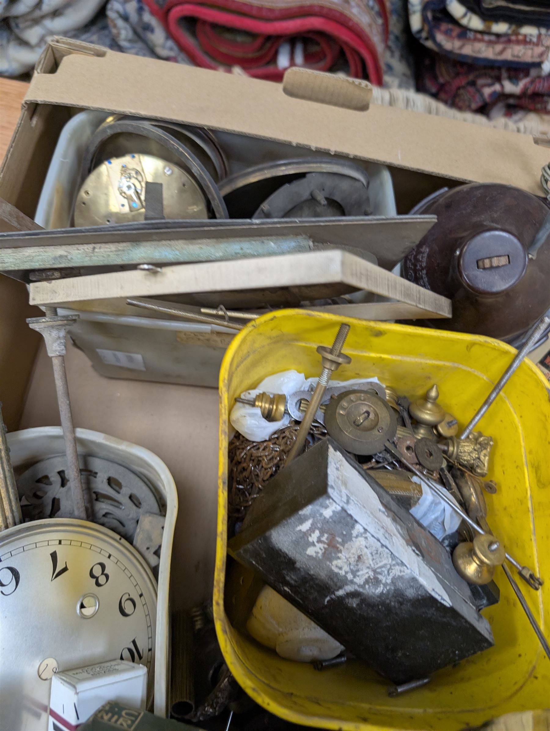 Collection of clock parts and accessories, including movement, faces, dials, tools, brass fittings, etc, in three boxes