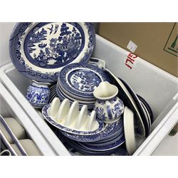 Collection of blue and white tea and dinner wares mainly in willow to include plates, cups and saucers, teapots etc, in three boxes 
