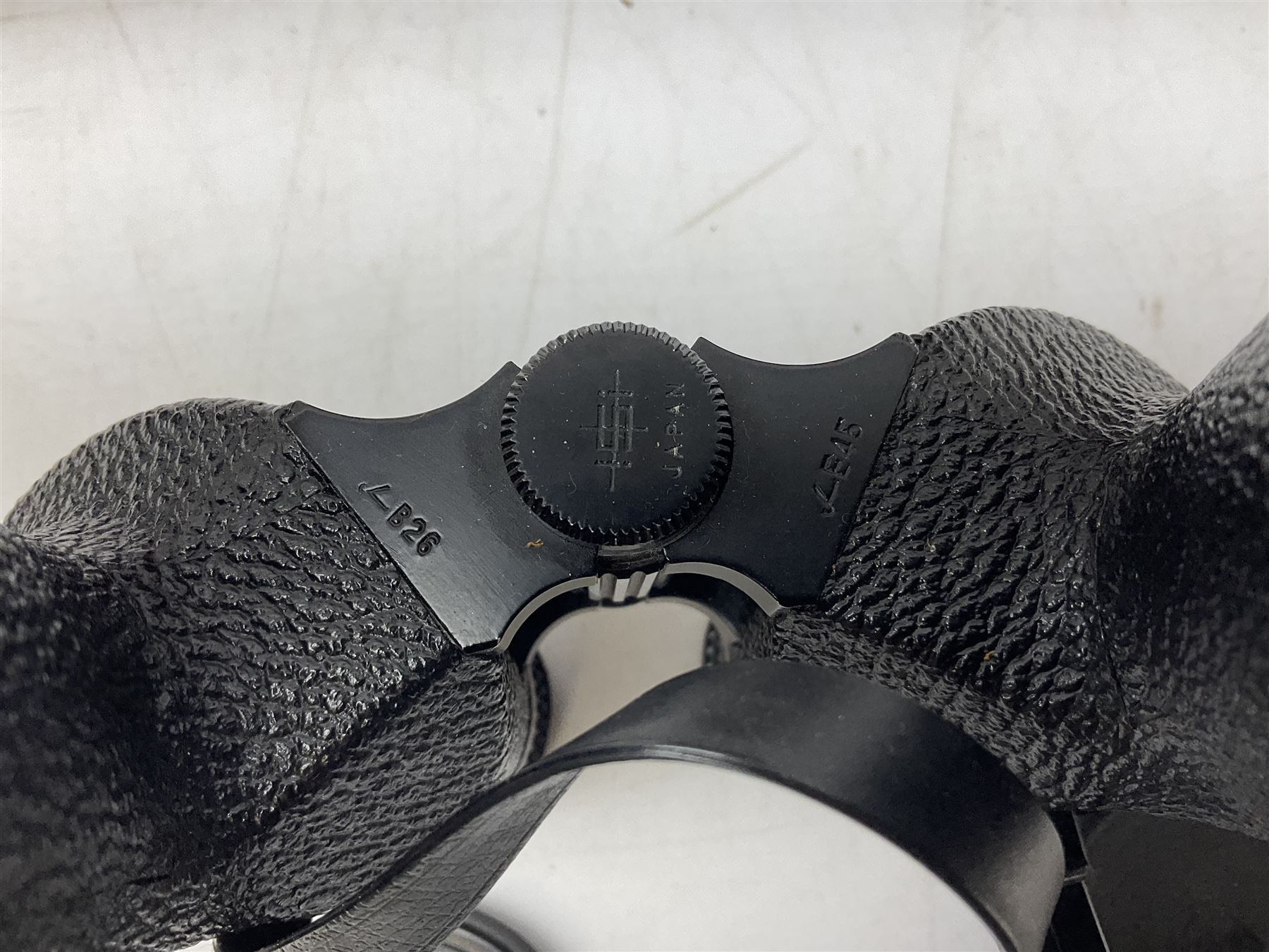 Cast metal nutcracker, in the form of a dog together with a pair of Swift Saratoga 8x40 binoculars in leather case and a hip flask, the glass flask covered in leather to the top with a detachable silver plated cup to base