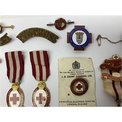 Collection of St John Ambulance enamel and metal badges, together with Red Cross medals and badges